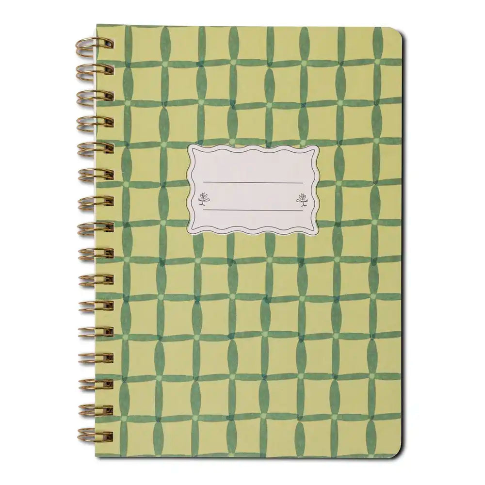 Notebook with green geometric pattern on a white background