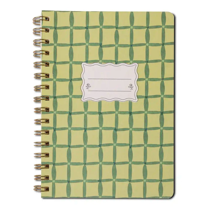 Notebook with green geometric pattern on a white background
