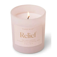 Candle in a pink glass container