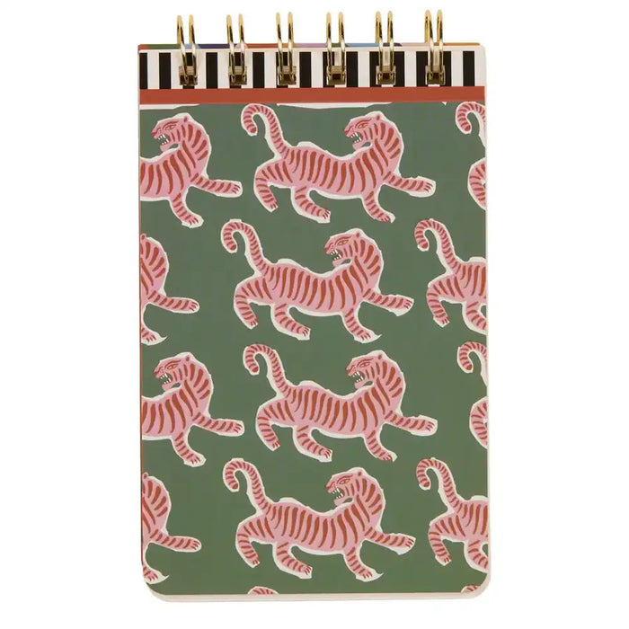Notebook with pink tiger pattern on a green background