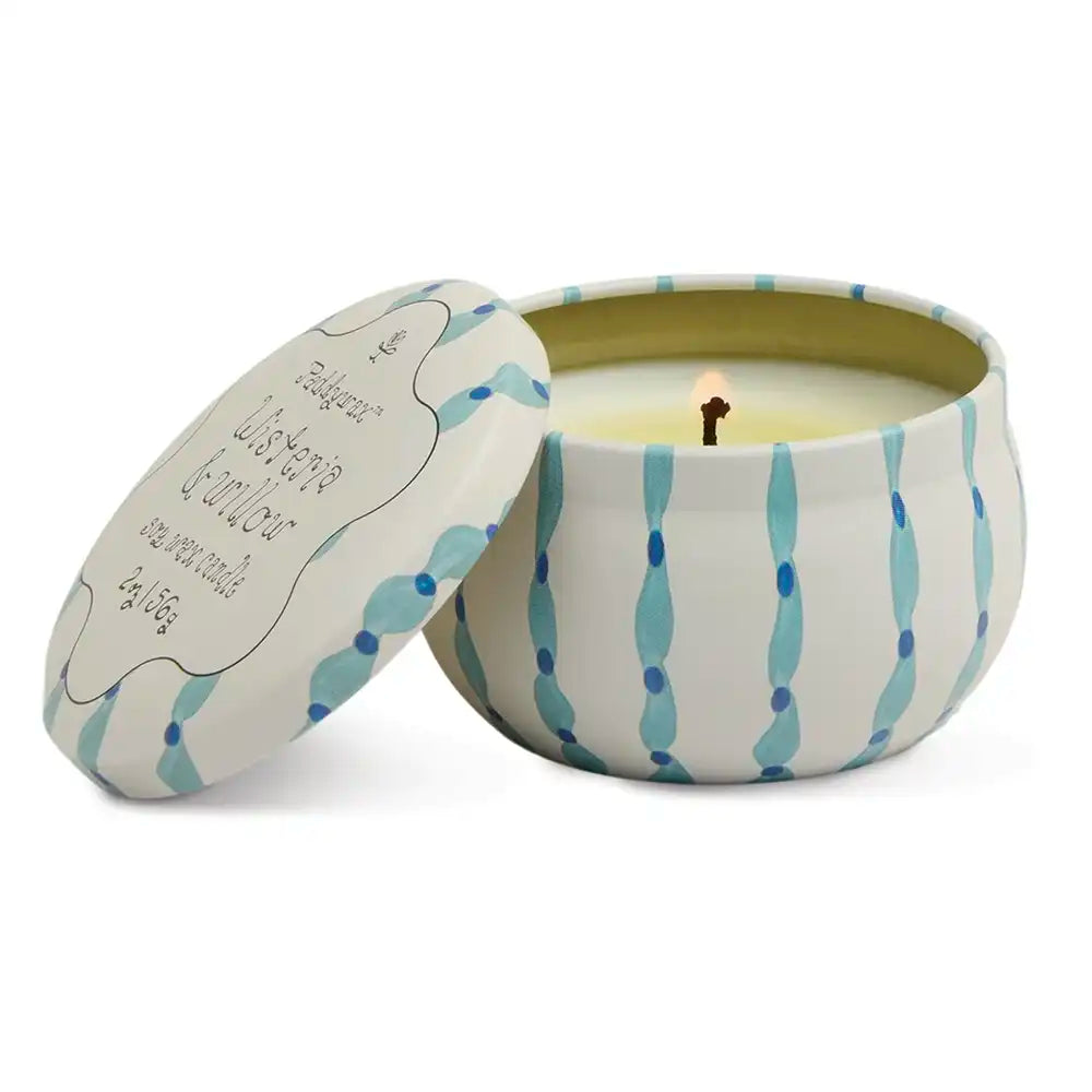 Candle in a decorative tin with a striped pattern on a white background