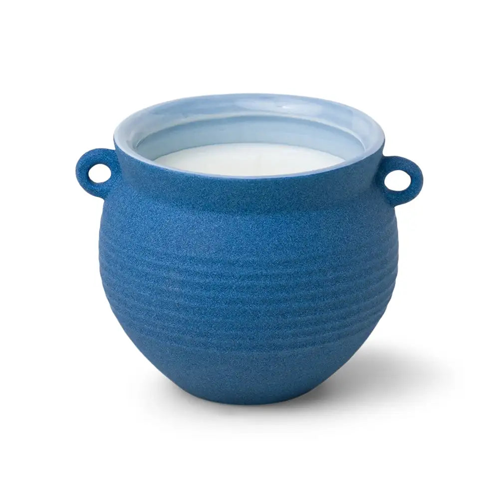 Blue ceramic bowl with white interior on a white background