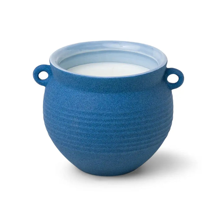 Blue ceramic bowl with white interior on a white background