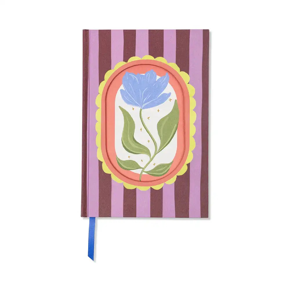 Notebook with a floral design on the cover against a white background