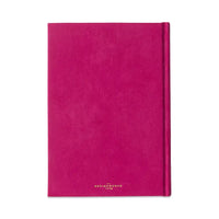 A bright pink hardcover notebook 