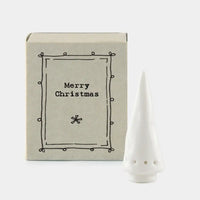 East of India tiny white  china Christmas tree in a matchbox. Against a white background.