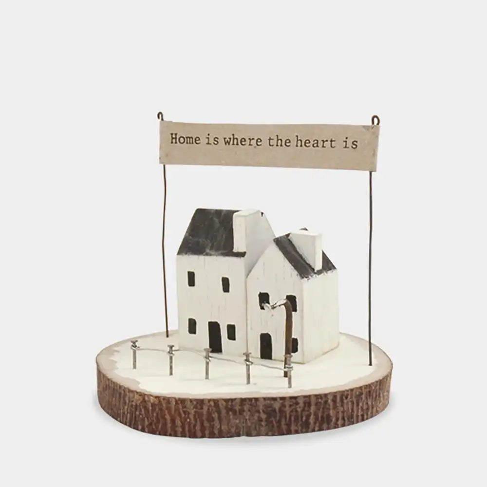 Decorative house model with a banner on a white background