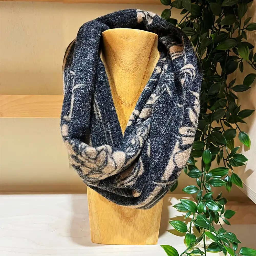 Grey and Beige patterned snood on a wooden stand 