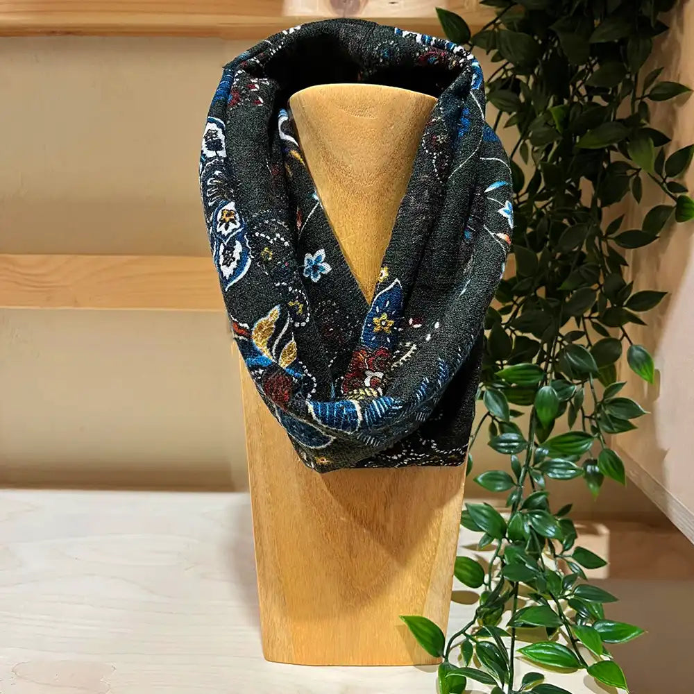 khaki green snood with a multi coloured paisley pattern 