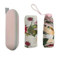 Foldable floral umbrella with pink case on a white background
