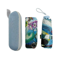 Foldable umbrella with floral design and matching case on a white background