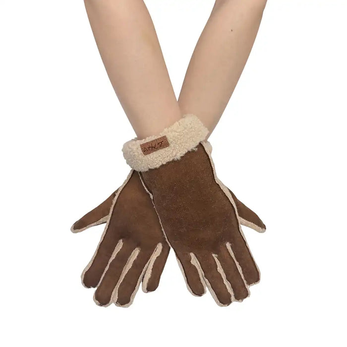 Brown gloves with beige lining worn on a white background