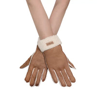 Pair of brown gloves with white cuffs and lining on a white background