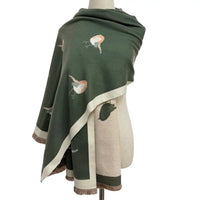 Khaki green scarf draped over ghost model with robins on. Frayed edges.