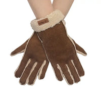 A pair of brown suede-like gloves with cream sherpa lining and a matching cream cuff, shown on a person's hands against a plain white background.