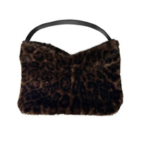A leopard-print faux fur shoulder bag with a black leather handle, shown against a plain white background.