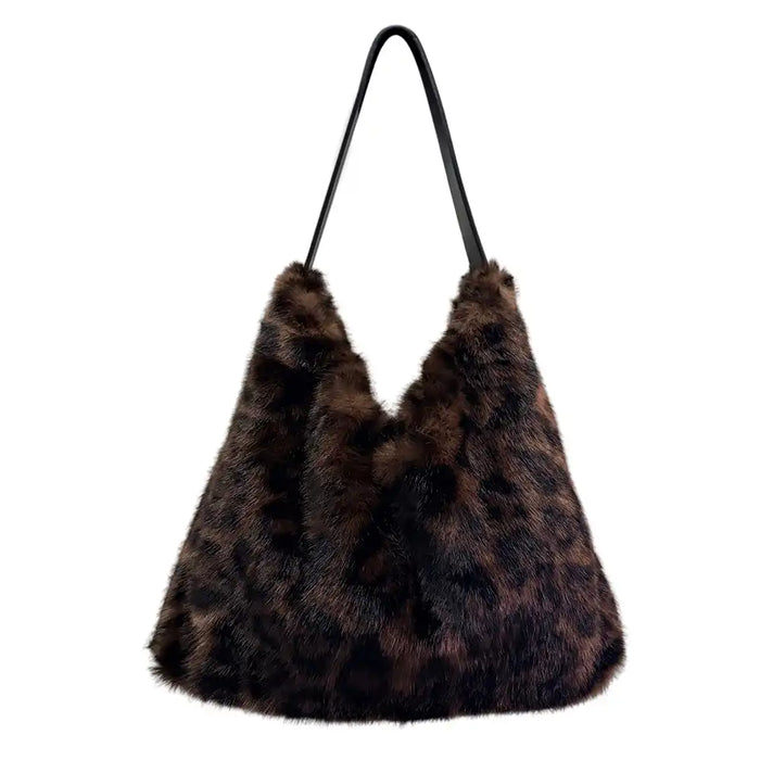 A dark brown and black faux fur hobo shoulder bag with a single black strap, shown against a plain white background.