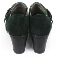 Fly London oil suede heeled shoes in pine green. Cross over strap with dark metal buckle. Decorative stitching over the toes. Back view.