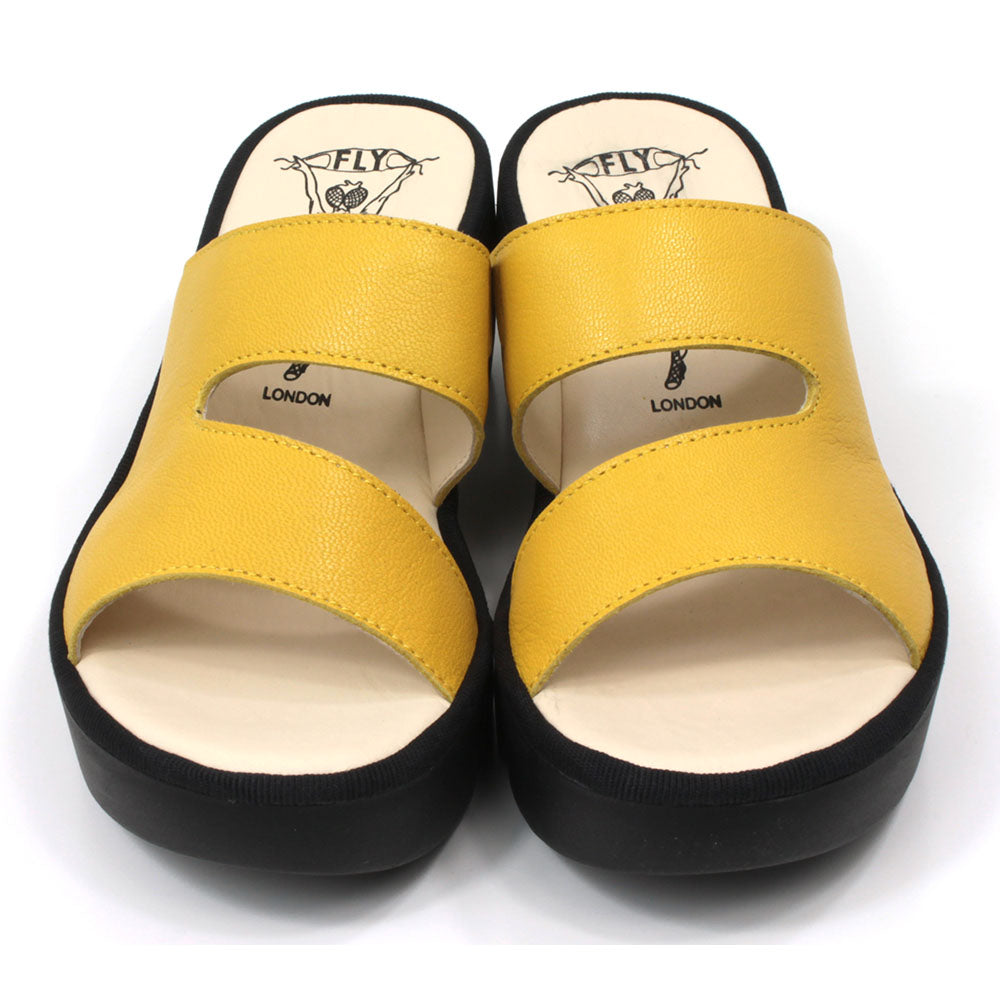 Fly London Mousse mule style sandals in yellow leather. Black chunky rubber heels and soles. Front view