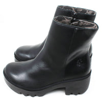 Fly London black ankle boots with zip fastening. Leather with chunky soles. Side view.