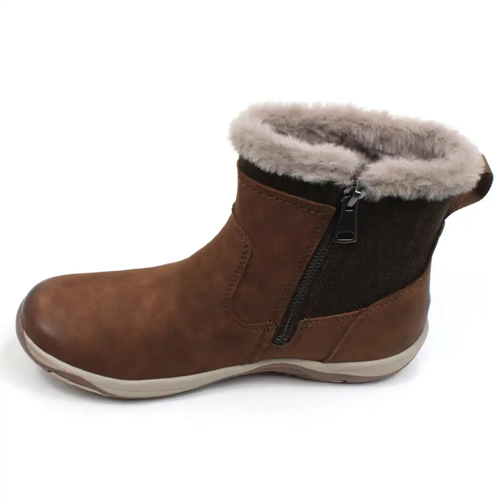 Free Spirit Charlie ankle boots in tan. Beige fur interior and around the ankle cuffs. Fabric to the rear. Zip up fitting. View of a single boot showing the zip.