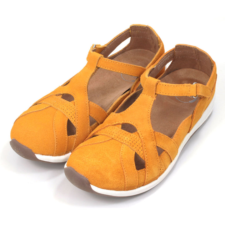 Leather sandals which enclose feet and heels. Bright mustard colour. Angled view.