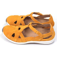 Leather sandals which enclose feet and heels. Bright mustard colour. Side view.