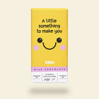  Yellow packaging features a saying of 'a little something to make you' and in the middle has a smiling face.