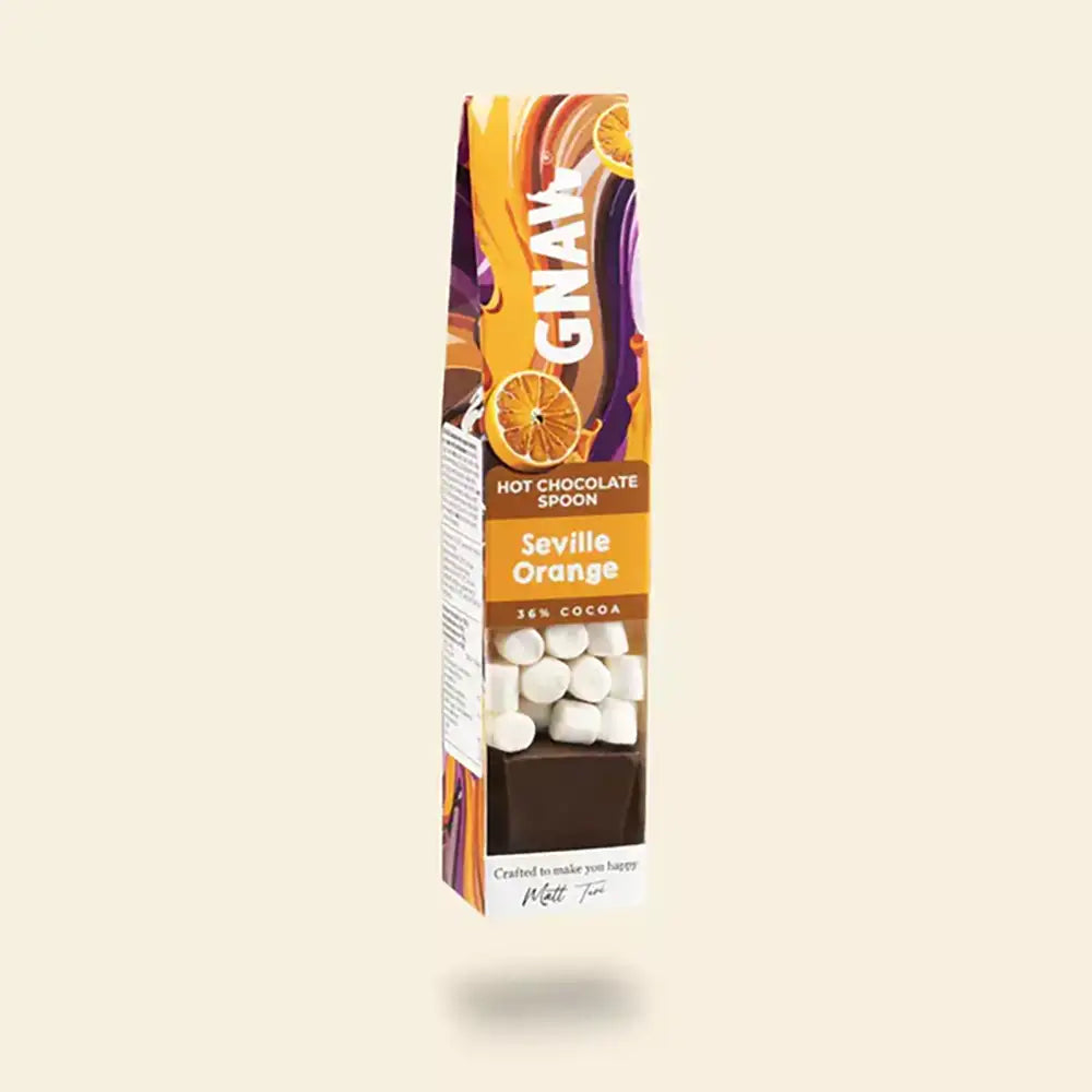Gnaw Seville Orange hot chocolate spoon packaging on a beige background