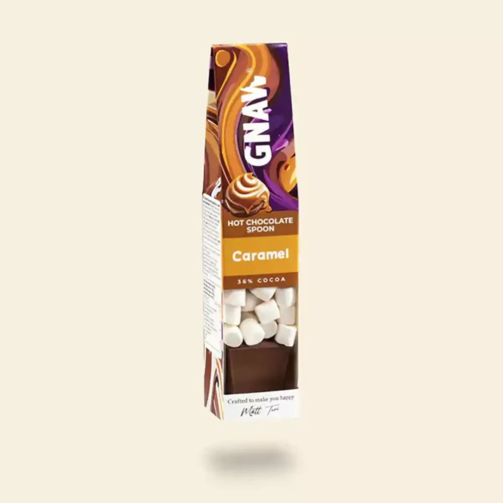 GNAW Caramel hot chocolate spoon packaging on a beige background