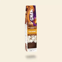 GNAW Caramel hot chocolate spoon packaging on a beige background
