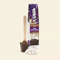 GNAW milk chocolate hot chocolate spoon packaging with a spoon and marshmallows on a beige background