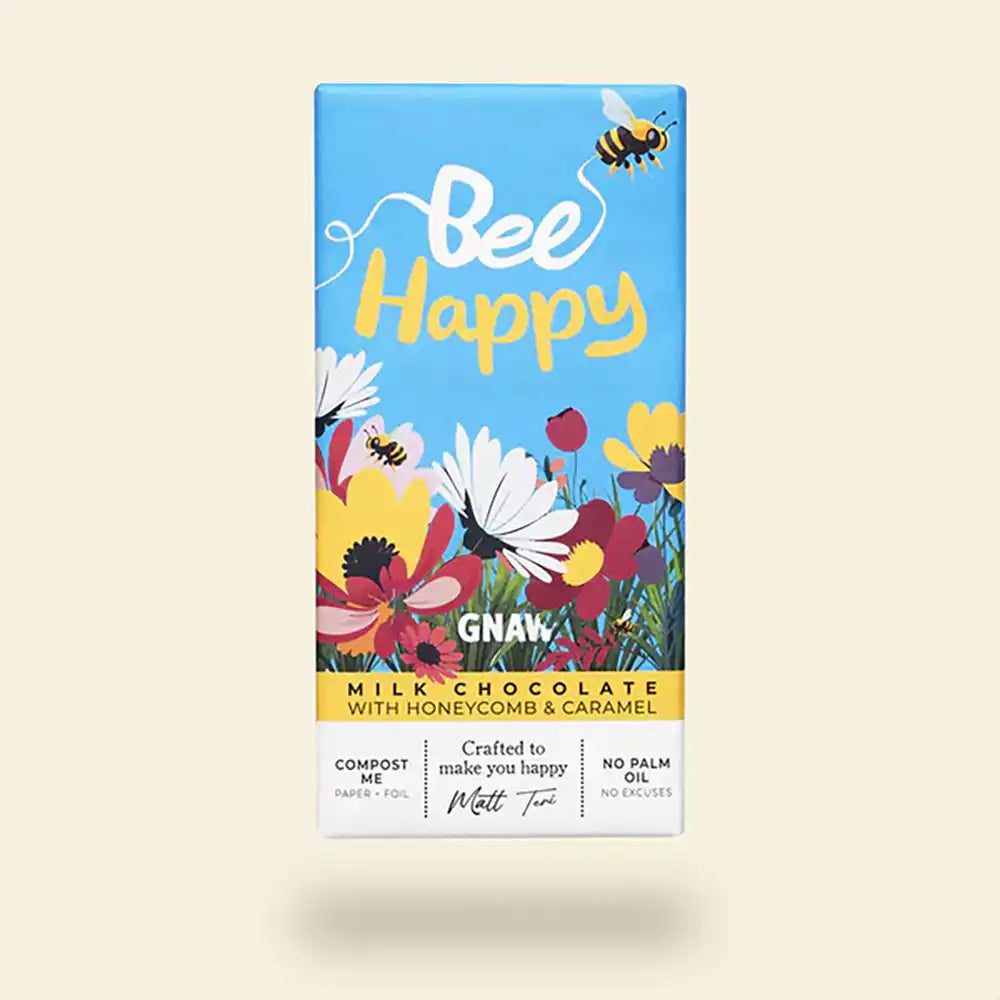 Bee Happy milk chocolate bar packaging with flowers and bees on a beige background