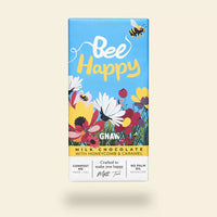 Bee Happy milk chocolate bar packaging with flowers and bees on a beige background
