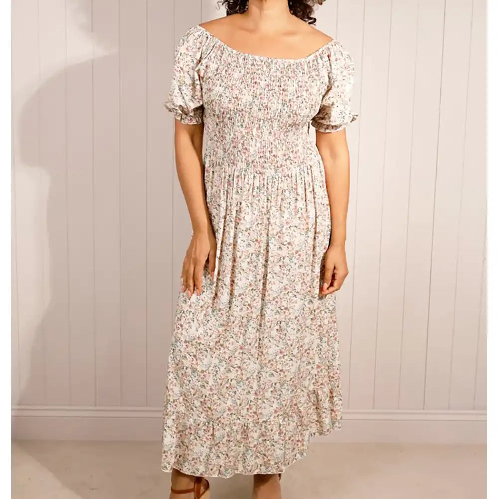 Beige floral maxi dress with shirred bodice  and tiered skirt. 