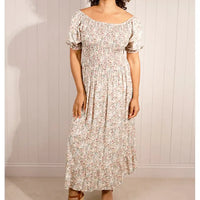 Beige floral maxi dress with shirred bodice  and tiered skirt. 