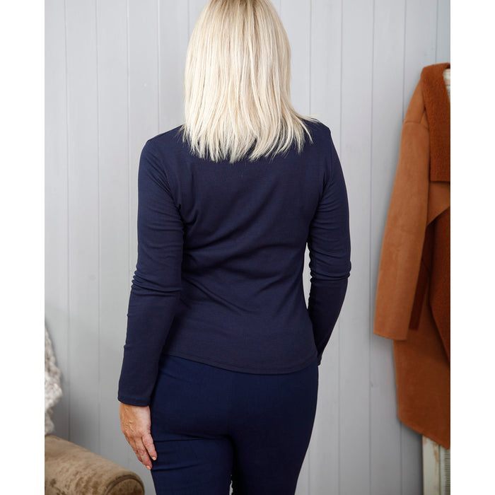 Goose Island long sleeved, polo necked navy blue top. Back view.