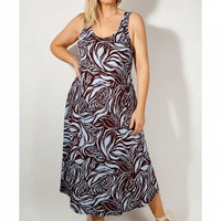 Woman in a patterned sleeveless dress