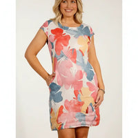 Woman wearing a short cap sleeved dress with large butterfly pattern