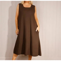 Brown sleeveless dress worn by a person against a plain background