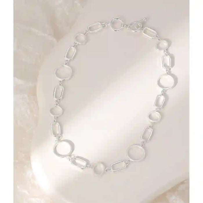 Mixed shape silver necklace with T bar fastener