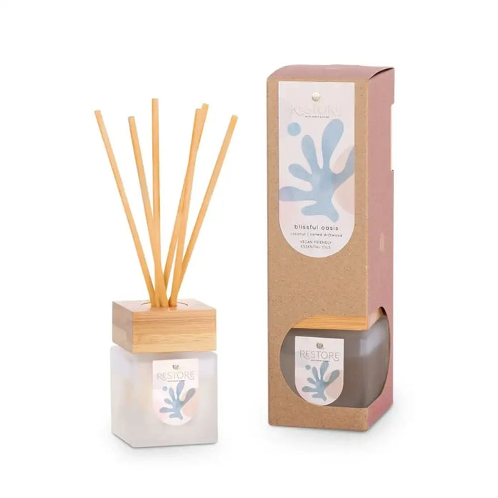 Reed diffuser set with packaging on a white background