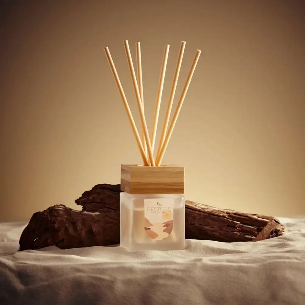 Diffuser with wooden sticks on a neutral background