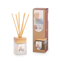 Reed diffuser with wooden sticks and packaging on a white background