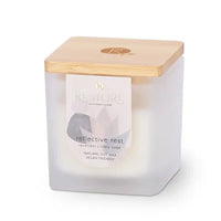 Candle with wooden lid labeled 'Reflective Rest' on a white background
