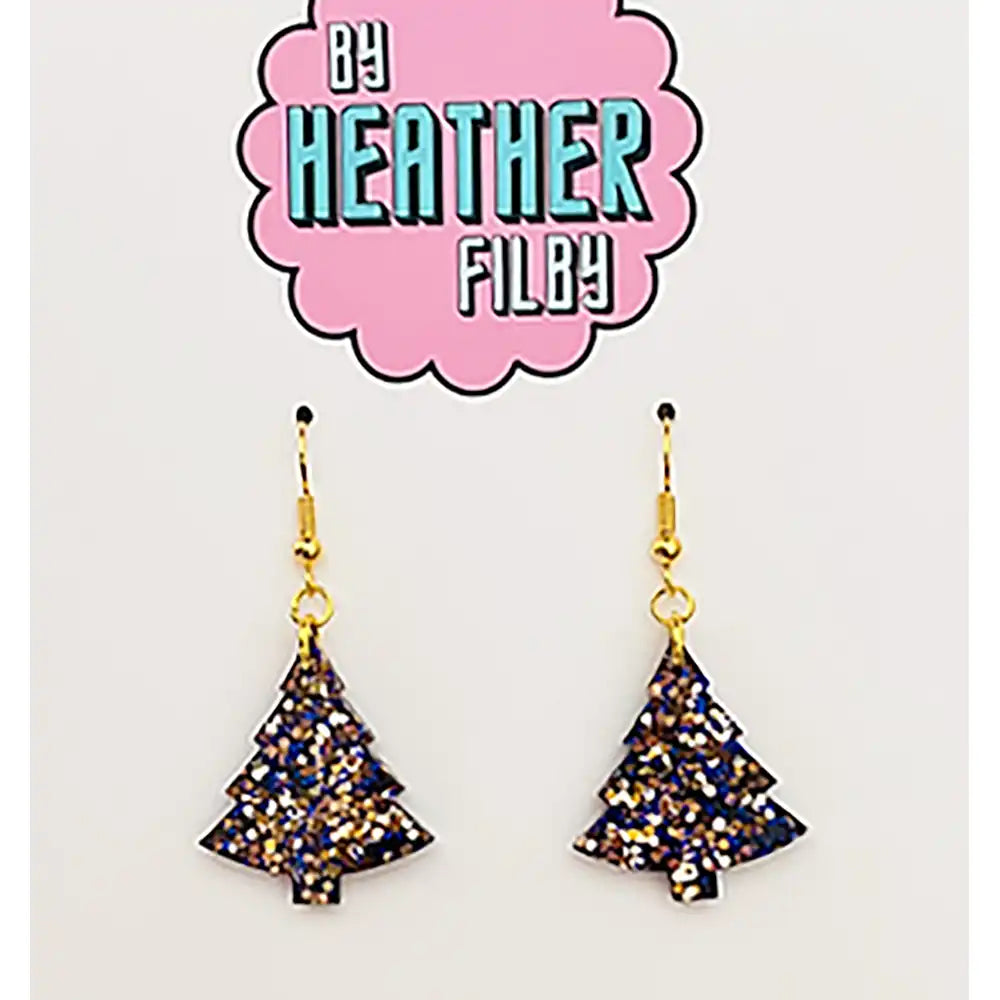 Tree-shaped earrings with glittery finish on a 'By Heather Filby' branded card.
