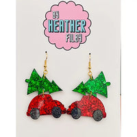Red car earrings with green trees on a card by Heather Filby