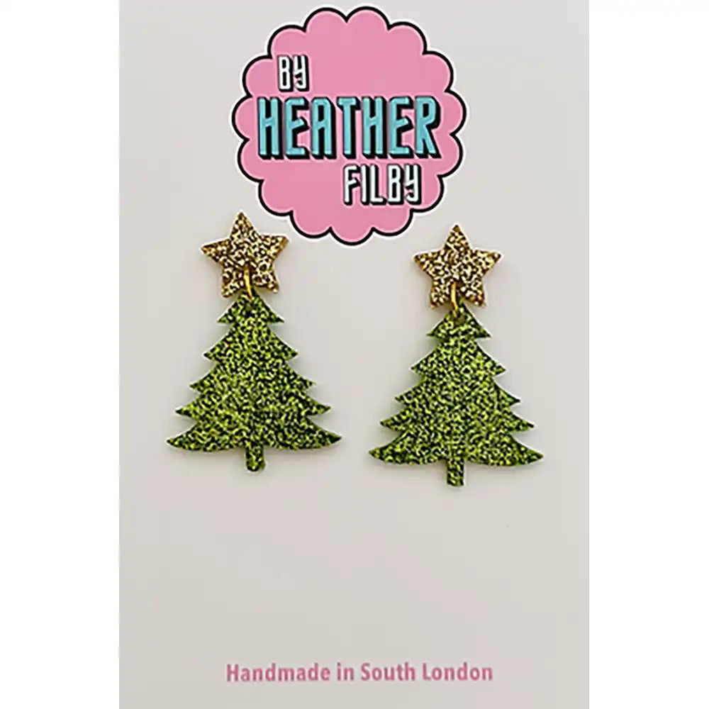 Green glittery Christmas tree earrings with gold stars on a white background, branded by Heather Filby.