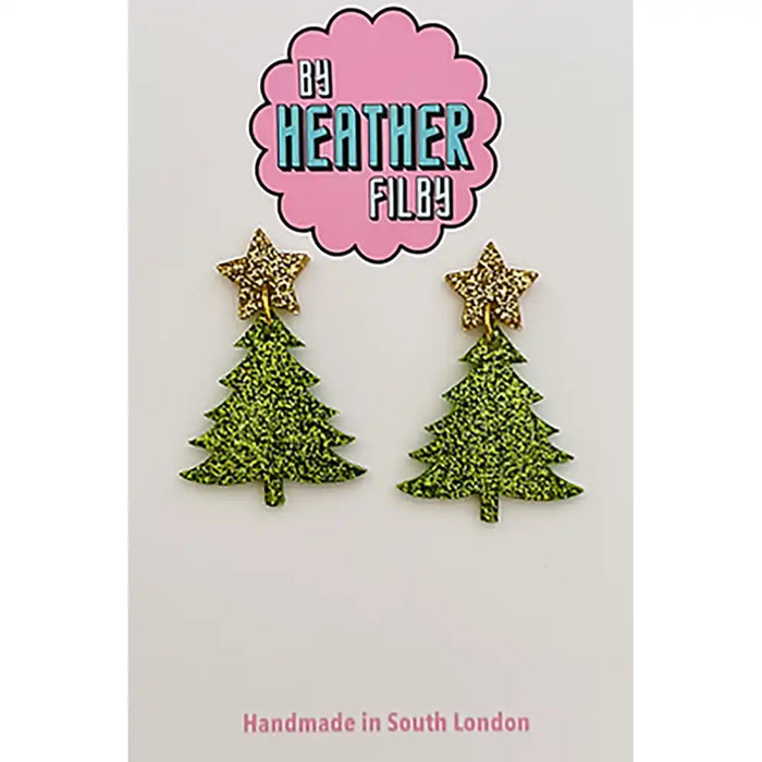 Green glittery Christmas tree earrings with gold stars on a white background, branded by Heather Filby.