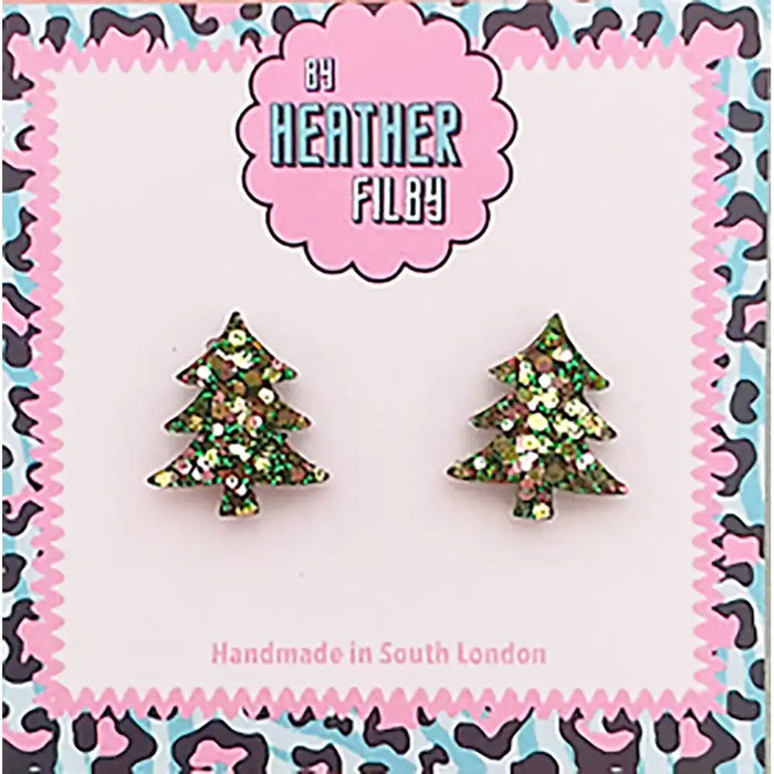 Tree-shaped earrings on a card with 'Heather Filby' branding and leopard print border.